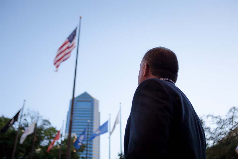 Mike looking at flag